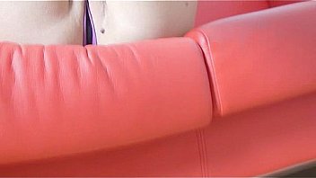 Brunette masturbating with her feet