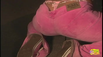 Her female partner inserts a lengthy sex toy into her vagina to bring her to orgasm