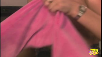 Her female partner inserts a lengthy sex toy into her vagina to bring her to orgasm