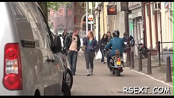 Dark beauty sucks a large pole