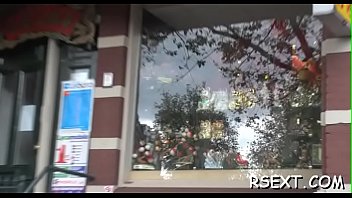 Dark beauty sucks a large pole