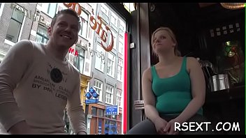 Dark beauty sucks a large pole