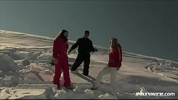 Members of the ski rescue patrol find a stranded skier and screw him