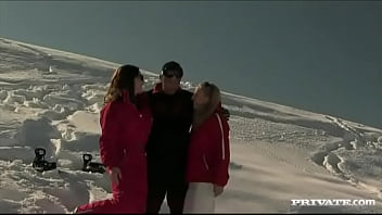 Members of the ski rescue patrol find a stranded skier and screw him