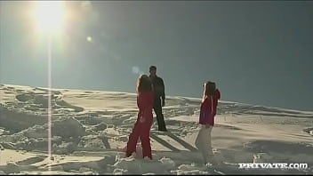 Members of the ski rescue patrol find a stranded skier and screw him