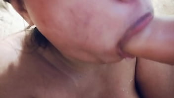 Sucking on a big realistic and messy full of milk dildo closeup