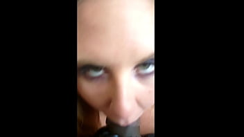 Blonde dominatrix sucks off thick black cock