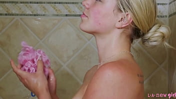 Glamorous blonde icon enjoys a sensual bath