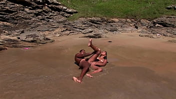 Gorgeous brunette girl fucks with a mulatto guy at the sea