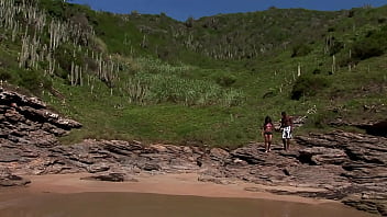 Gorgeous brunette girl fucks with a mulatto guy at the sea