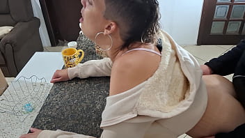 A stepdaughter is surprised while having breakfast