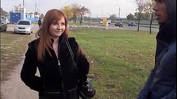 Busty redhead blowjob in a park