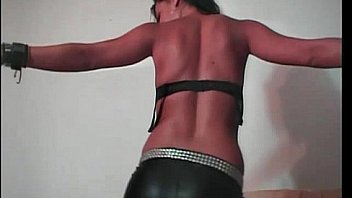 Brunette strip show in leather pants