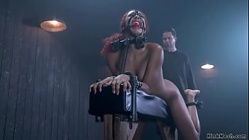 Redhead Ebony Slave Daisy Ducati In Black Latex Outfit Is Bound On Illuminating Table Then Gets Pussy Zappered And Ass Spanked By Master The Pope thumbnail
