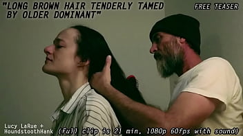 Long brown hair tenderly tamed by older dominant0