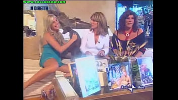 Live television panty oops upskirt as a hottie picks up a dog and leaves her underwear on display
