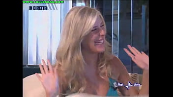 Live television panty oops upskirt as a hottie picks up a dog and leaves her underwear on display