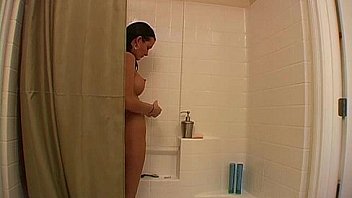 Busty amateur soaping up her tits in the shower