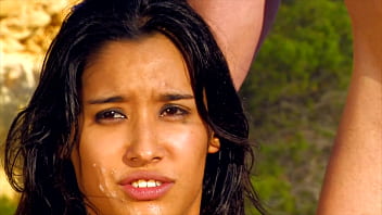 Exotic beauty with big tits on the beach