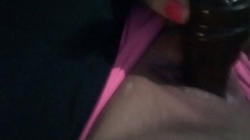 Playing with a dildo