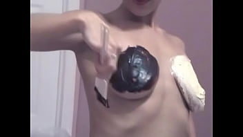 Blonde babe paints her tight juicy body