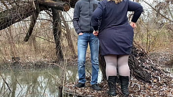 Sexy mother in law pissing outdoors with her legs spread wide and bent over