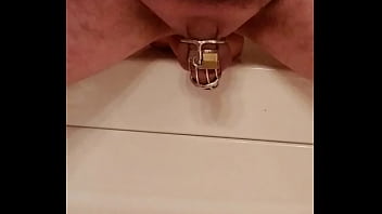Man in chastity fucks dildo hard