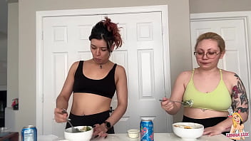 Two friends eat and belch