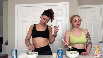 Two friends eat and belch