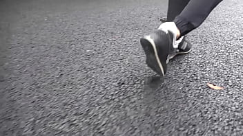 Walk on the road wearing fluffy sneakers