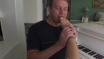 Hottie strokes a cock with her feet