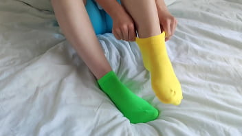 Her brightly colored mismatched socks are perfect for a sensual sockjob