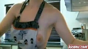 Sexy busty brunette milf has fun in the kitchen