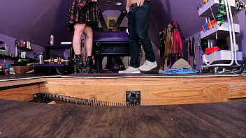 Dominatrix puts submissive man in bondage