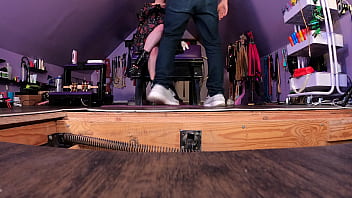 Dominatrix puts submissive man in bondage