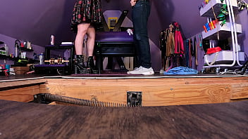 Dominatrix puts submissive man in bondage