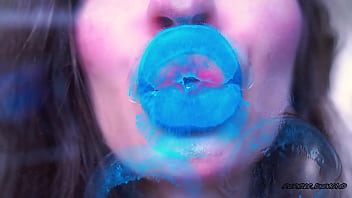 Wet red sticky lipgloss kiss