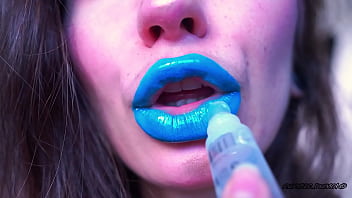 Wet red sticky lipgloss kiss