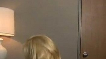 Busty blonde babe doing a striptease