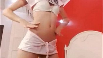 Lovelly teen strip dancing at home