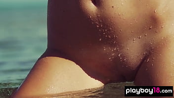 Skinny small titted babe posing naked in the rocks