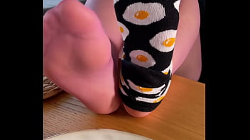 My so delicious nylon soles next to your plate with fried eggs