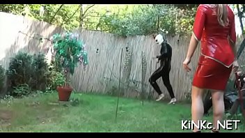 Female dom plays with ass bondman