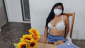 A fake student in a sexy short skirt masturbates at home with a dildo her tits look inflated