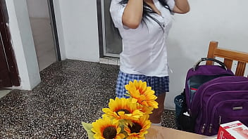 A fake student in a sexy short skirt masturbates at home with a dildo her tits look inflated