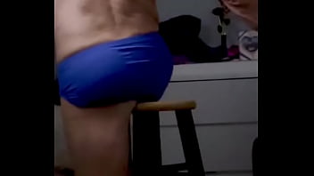 Onjon70 before bed on stool in blue briefs with television on