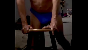 Onjon70 before bed on stool in blue briefs with television on
