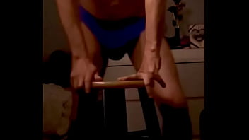 Onjon70 before bed on stool in blue briefs with television on