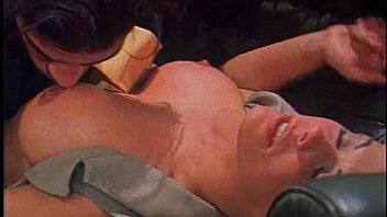 Blonde chick comforts her boyfriend in a couch