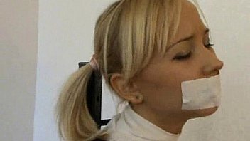 Cute innocent teen girl frogtied and tape gagged
